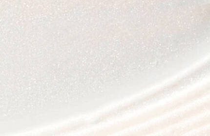 Close-up of a smooth, creamy surface with a subtle shimmer, resembling a textured white layer.