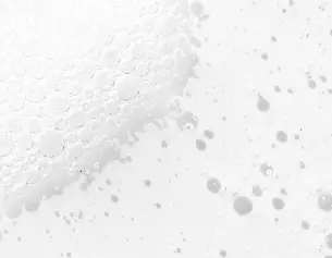 Close-up of white bubbles on a light surface, creating a textured, frothy appearance.