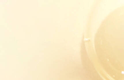 Abstract image featuring soft, translucent shapes in shades of beige and cream, creating a smooth and calming aesthetic.