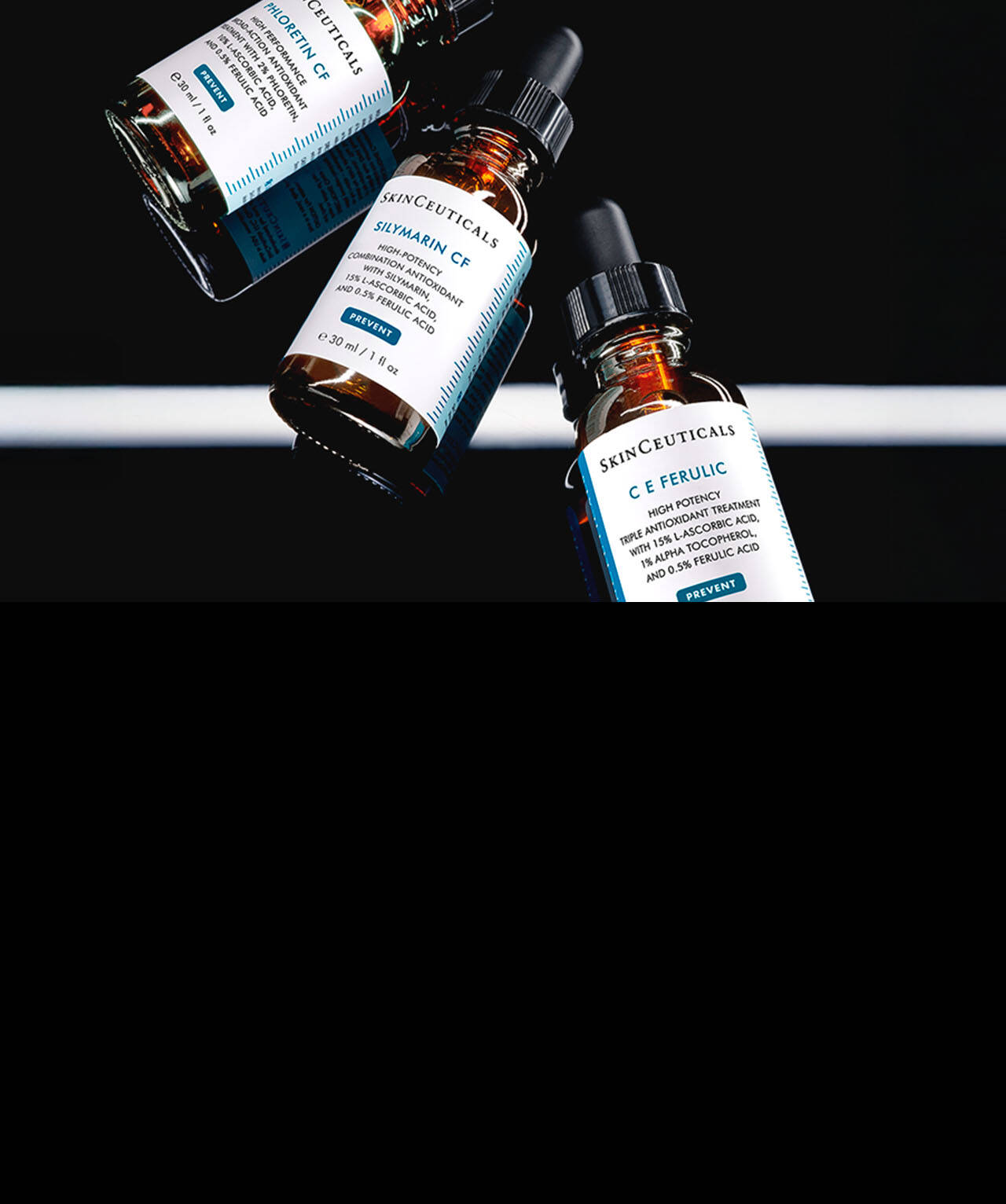 Una bottiglia di vetro ambrato di SkinCeuticals Silymarin CF, posizionata tra altre due bottiglie simili di C E Ferulic e Phloretin CF, su uno sfondo scuro.