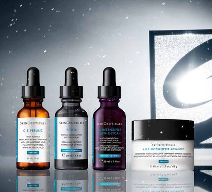 Una collezione di prodotti SkinCeuticals (CE ferulico, P-tiox, intensificatore multiglicano HA e interruttore AGE avanzato), esposti su uno sfondo invernale innevato con il logo Skinceuticals nero e argento.