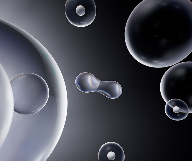 Immagine di bolle trasparenti che galleggiano su uno sfondo scuro, creando un effetto astratto e affascinante.