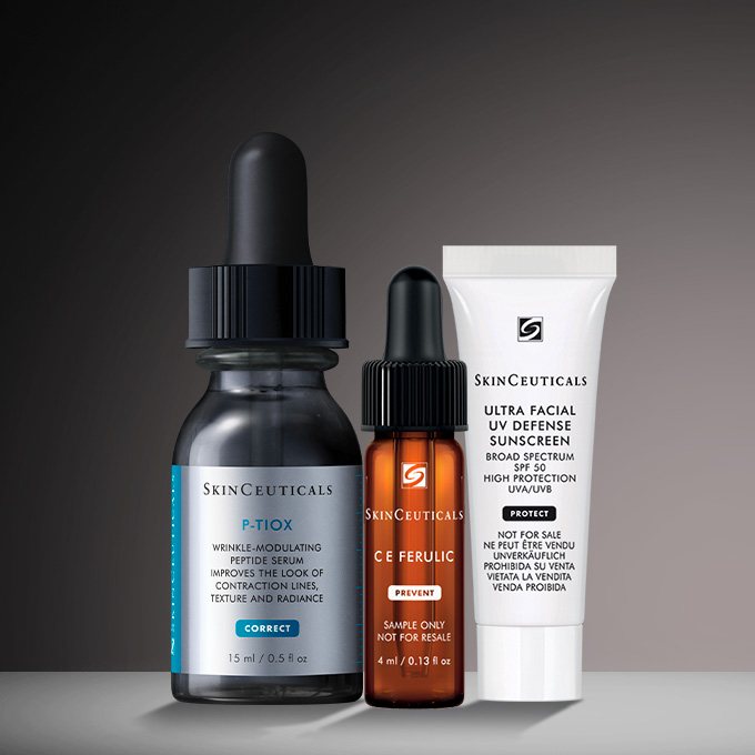Flacone di siero SkinCeuticals P-TIOX circondato da fiale, incentrato sulla correzione delle rughe.